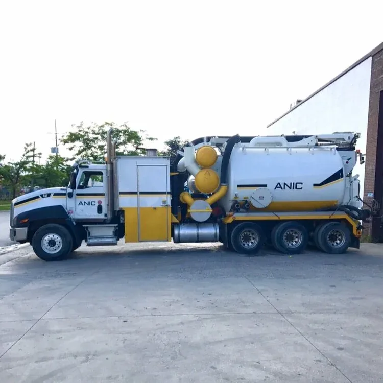 White and yellow ANIC CAT hydro vac truck in profile showing the vacuum tank and boom assembly